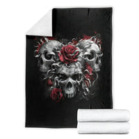Black skull blanket laid flat with red roses and gray smoke skulls