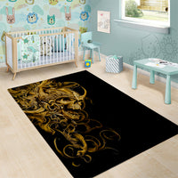 Black and gold skull area rug with ornate curling lines, rectangular