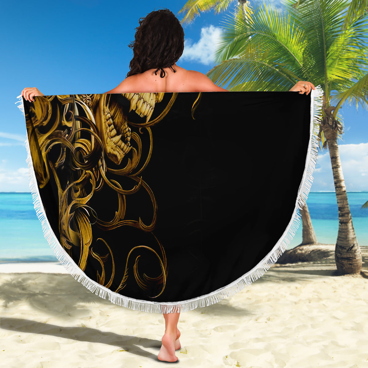 Skull beach blanket, round black center with golden artwork and white fringe border