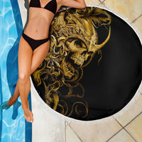 Round beach blanket close-up: golden skull design on black with white fringe border