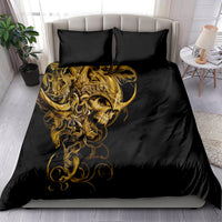 Black duvet cover with large golden skull design and ornate curls; two matching pillowcases