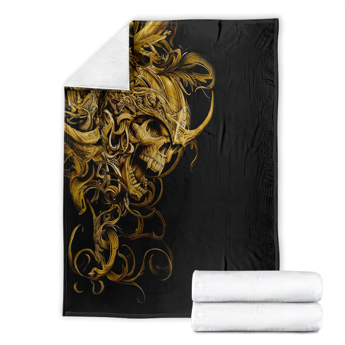 Black skull blanket with gold warrior skull design, folded with rolled white towels