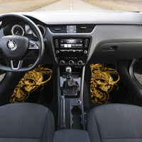 Black car floor mat set with golden warrior skull graphics on both front sides
