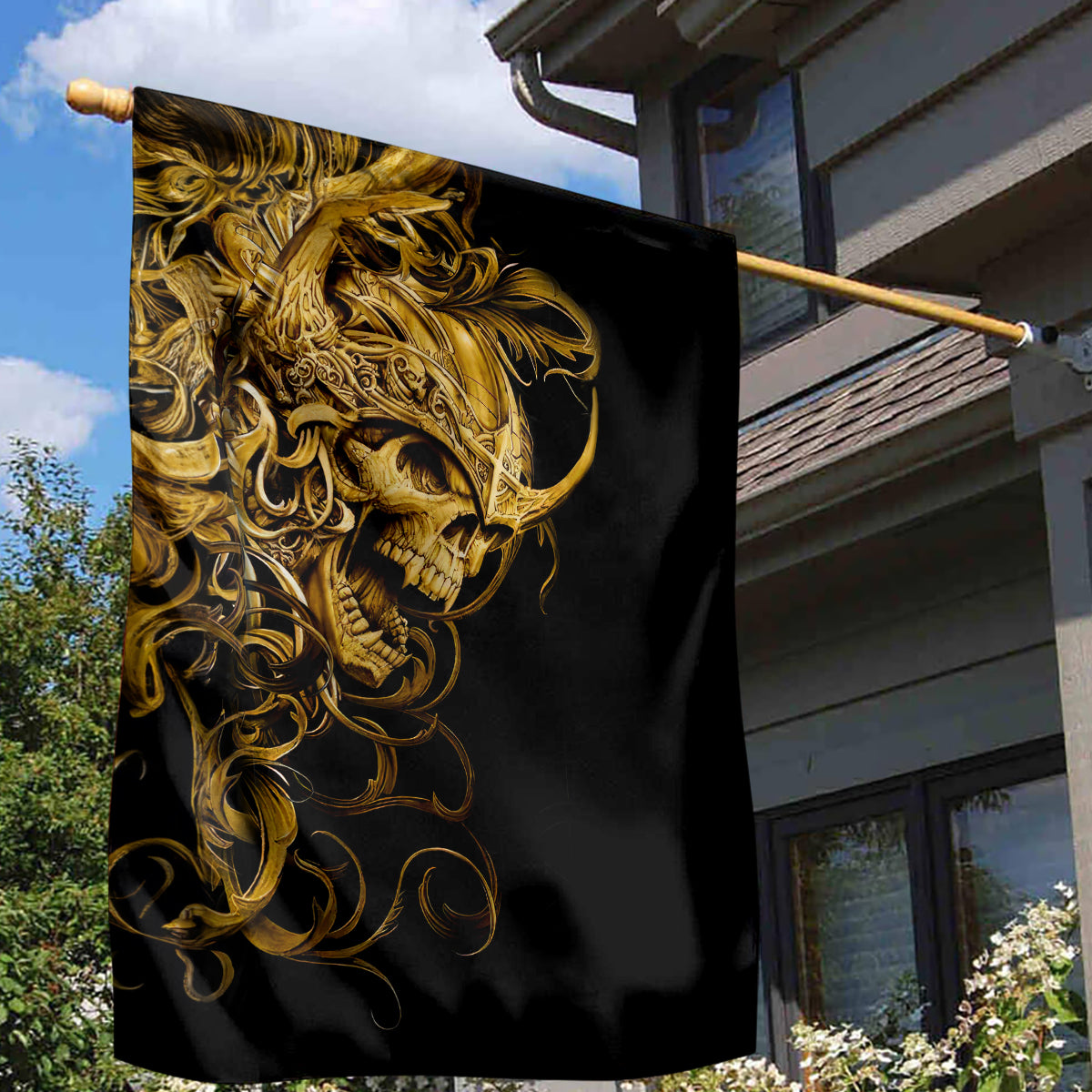 Black house flag with golden ornate skull warrior face, waving on bracket pole