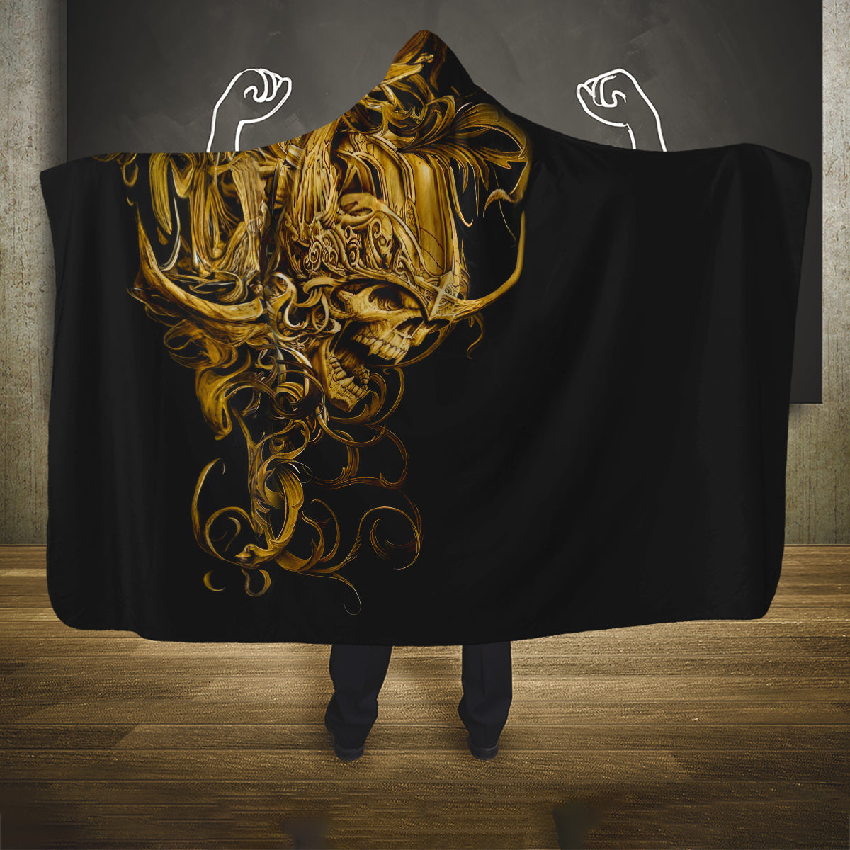 Black skull hooded blanket with gold warrior face graphic, wide cape design