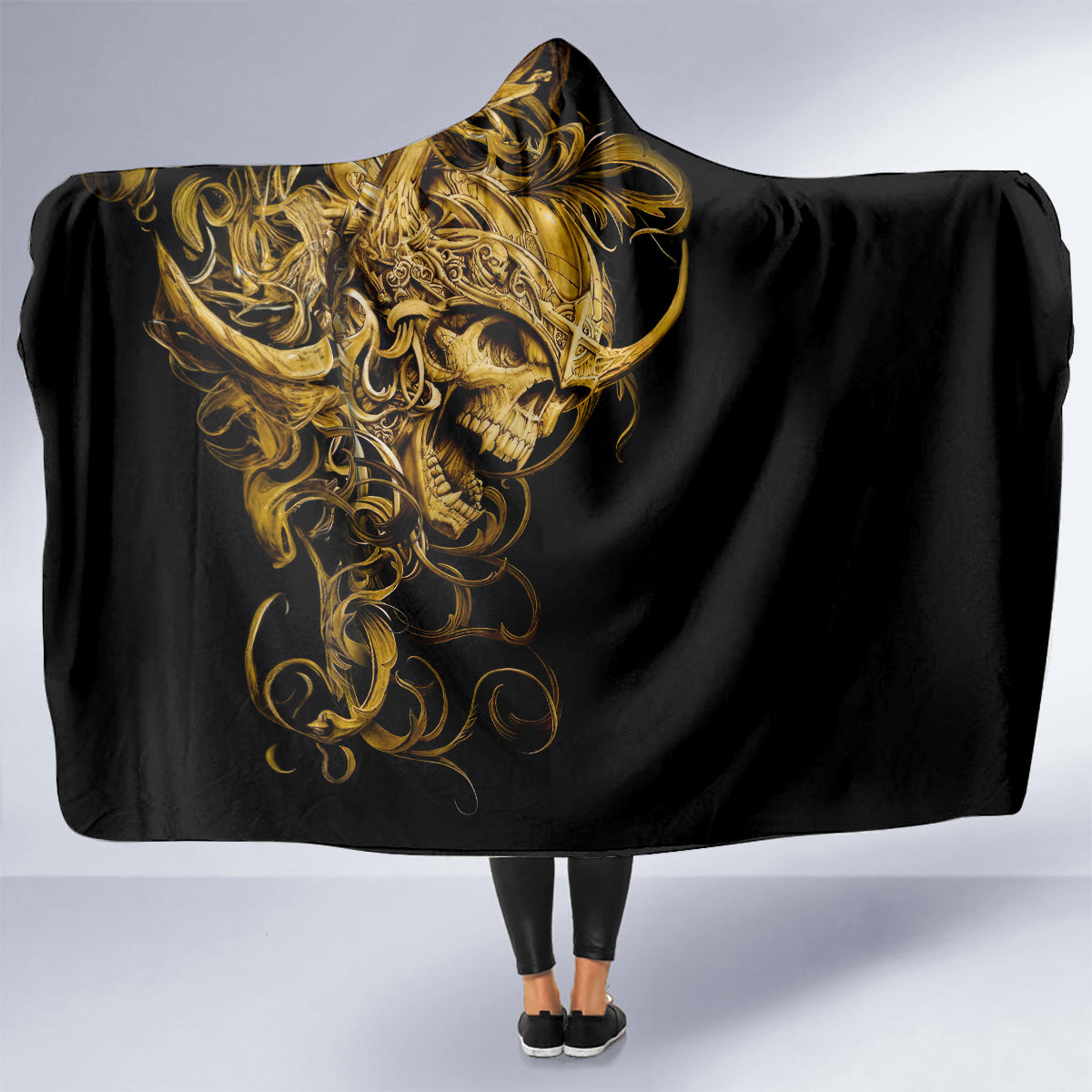 Black skull hooded blanket draped open, gold warrior skull art and hood