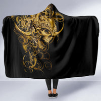 Black skull hooded blanket draped open, gold warrior skull art and hood