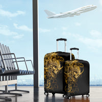 Two black luggage covers with golden ornate skull designs on rolling suitcases