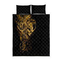Black quilt bed set with gold skull artwork and diamond quilting, plus two matching pillows