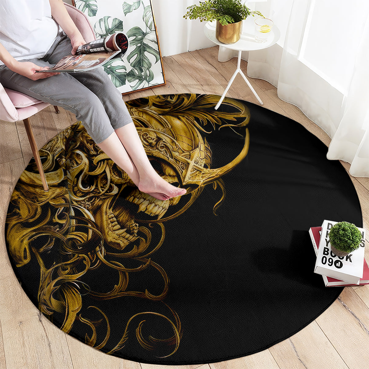 Round black rug with gold skull warrior graphic and swirling ornamental details