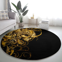 Round black area rug featuring a gold skull warrior face with decorative curls