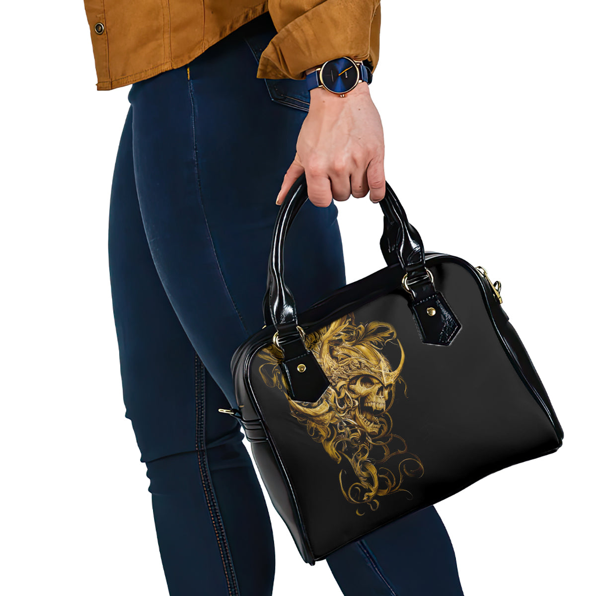 Black handbag on shoulder strap with gold warrior emblem, held by handles