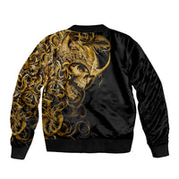 Black bomber jacket back with large gold skull graphic and ribbed hem, full-zip style