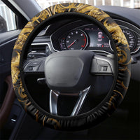 Black steering wheel cover with gold warrior design and padded textured rim