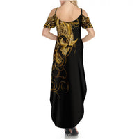 Women's black maxi dress with gold skull back print and open shoulder cutouts