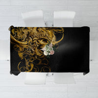 Black tablecloth with detailed skull-and-gold warrior design across the center.
