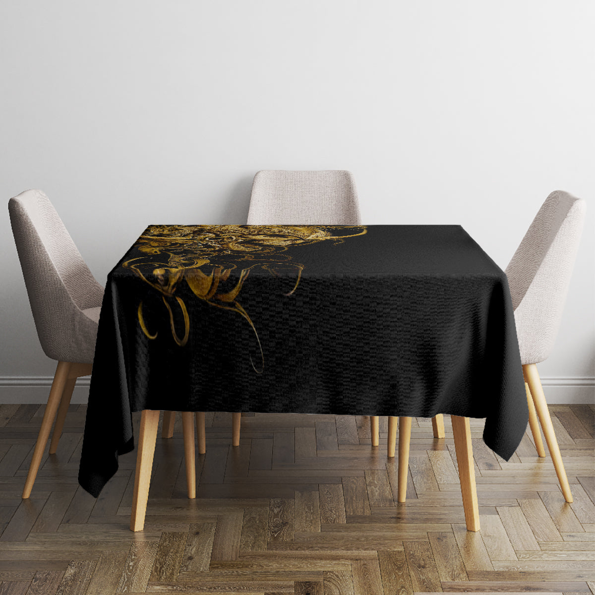 Black tablecloth with gold skull-and-warrior motif on a square dining table with chairs.
