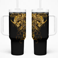 Black skull tumbler with handle, gold warrior artwork, white lid and two straws