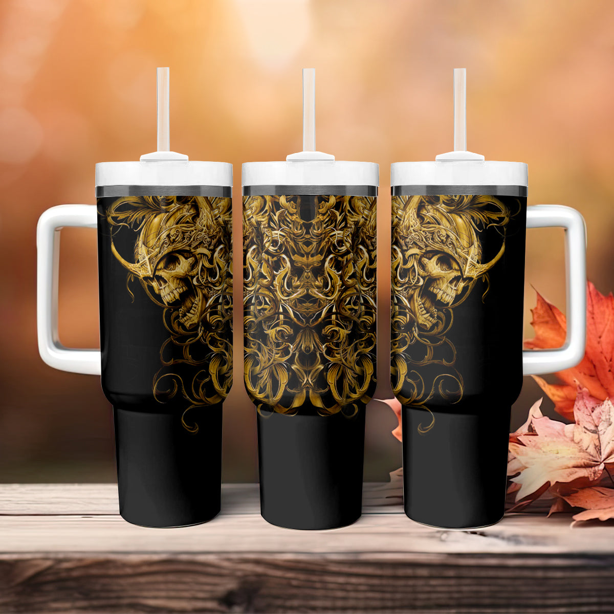Set of three black skull tumblers with handles, gold warrior artwork, white lids