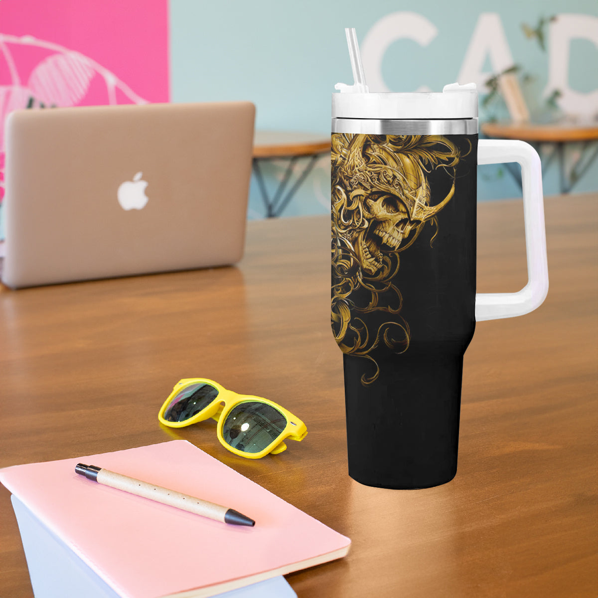 Black skull tumbler with handle, gold warrior skull artwork, white lid and straw