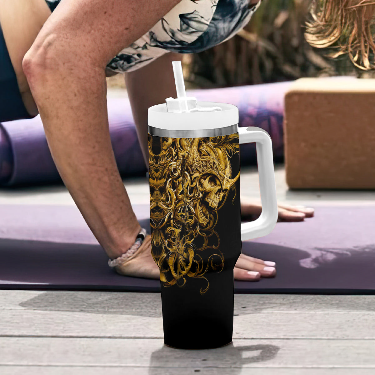 Black skull tumbler with handle, gold warrior skull graphic, white lid and straw