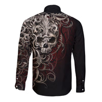 Black long-sleeve button shirt with large skull and filigree graphic on back