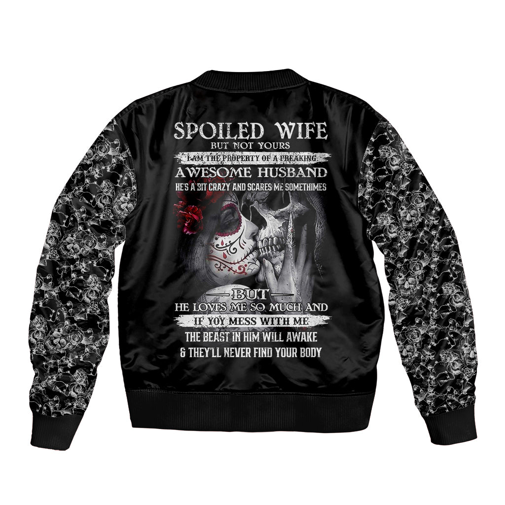 Black skull bomber jacket back with lyrics text, skeleton couple graphic, patterned sleeves