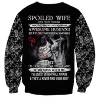 Unisex black sweatshirt back shows 'Spoiled Wife' quote with skull girl and skeleton design.
