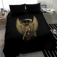 Black bedding set with centered gold steampunk winged skull emblem on duvet, 2 shams