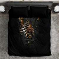 Black bedding set with steampunk skull-heart graphic on duvet and two matching pillowcases