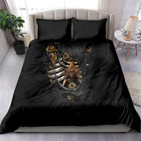 Black bedding set on bed: steampunk skull-heart duvet with two matching pillowcases