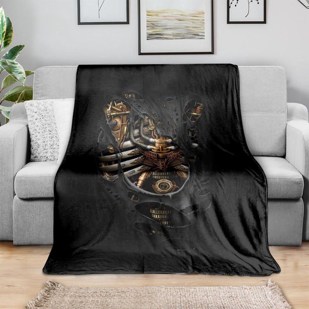 Black skeleton steampunk blanket draped over couch, skull and heart graphic