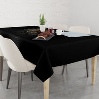 Black skull steampunk tablecloth covering dining table with folded corner