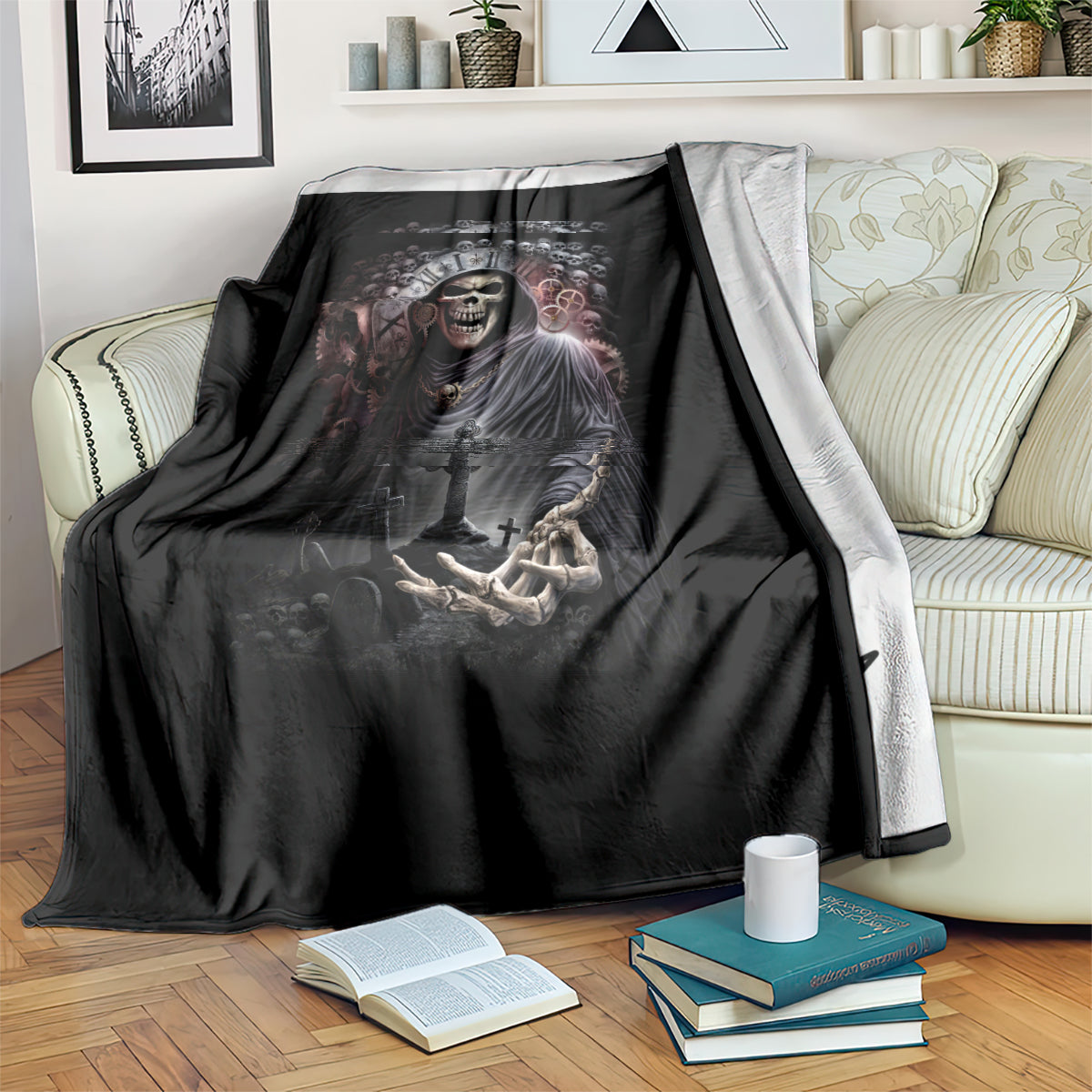 Black grim reaper skull blanket over an armchair, crown, cross, and skeletal hand motif