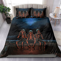 Dark skull bedding set with three skeleton graphic on duvet and two pillowcases