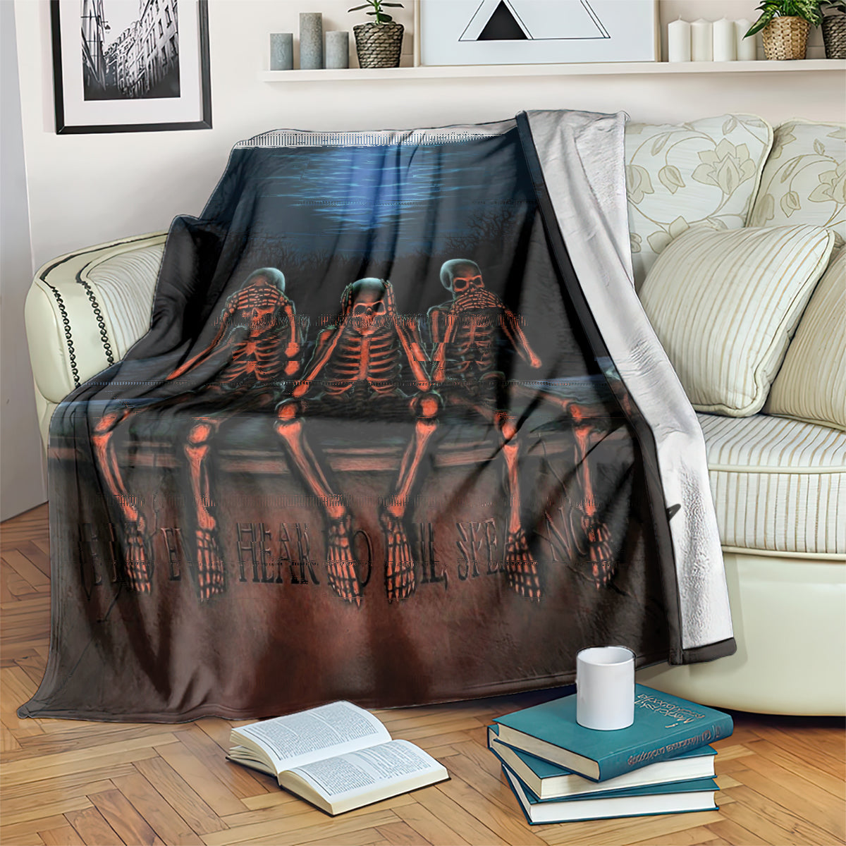 Black skeleton skull throw blanket on sofa bed, three orange skeletons and blue wave