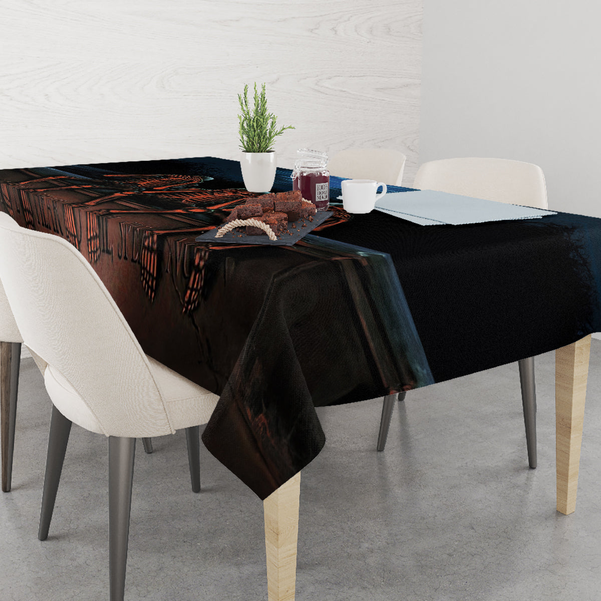 Black Halloween tablecloth with skeleton ribs and drippy skull artwork