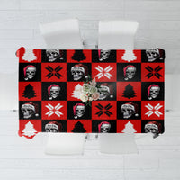 Red skeleton Christmas tablecloth with checker squares, skulls, trees, and snowflake accents