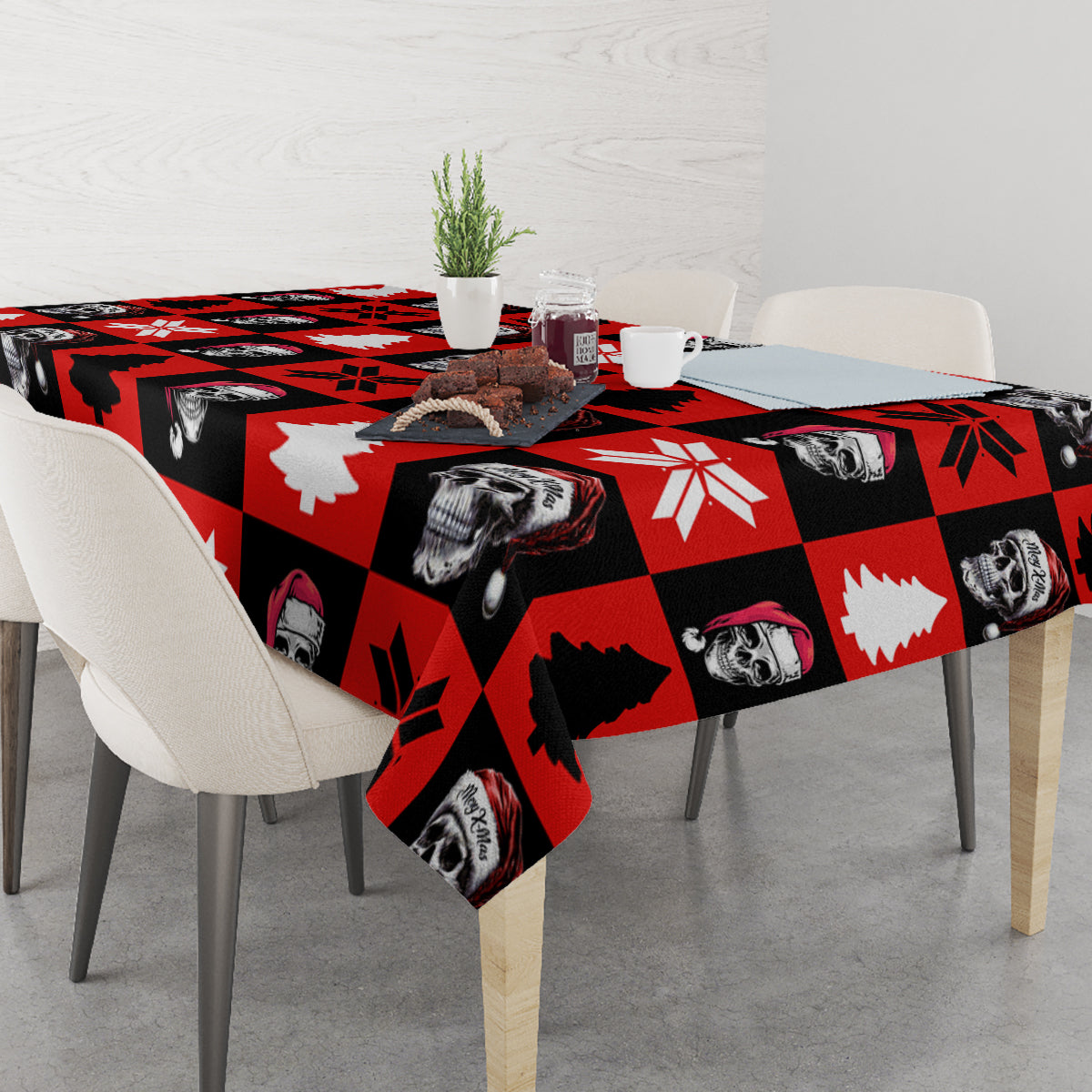 Red skeleton Christmas tablecloth on dining table with skull, tree, and snowflake motifs