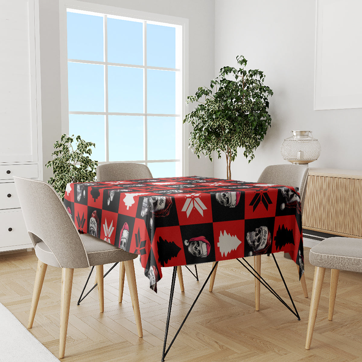Red skeleton Christmas tablecloth covering dining table with skull, tree, and snowflake graphics