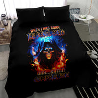 Black bedding set with flaming skull graphic and bold slogan text on duvet, plus two pillows