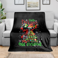Black skeleton Santa blanket draped over couch, Hello Darkness and My Old Friend print