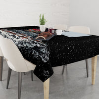 Black holiday tablecloth with winter skeleton Santa artwork and snowy forest print