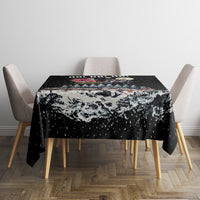 Black dining tablecloth with snowy skeleton Santa graphic, HO! HO! HO! at the center