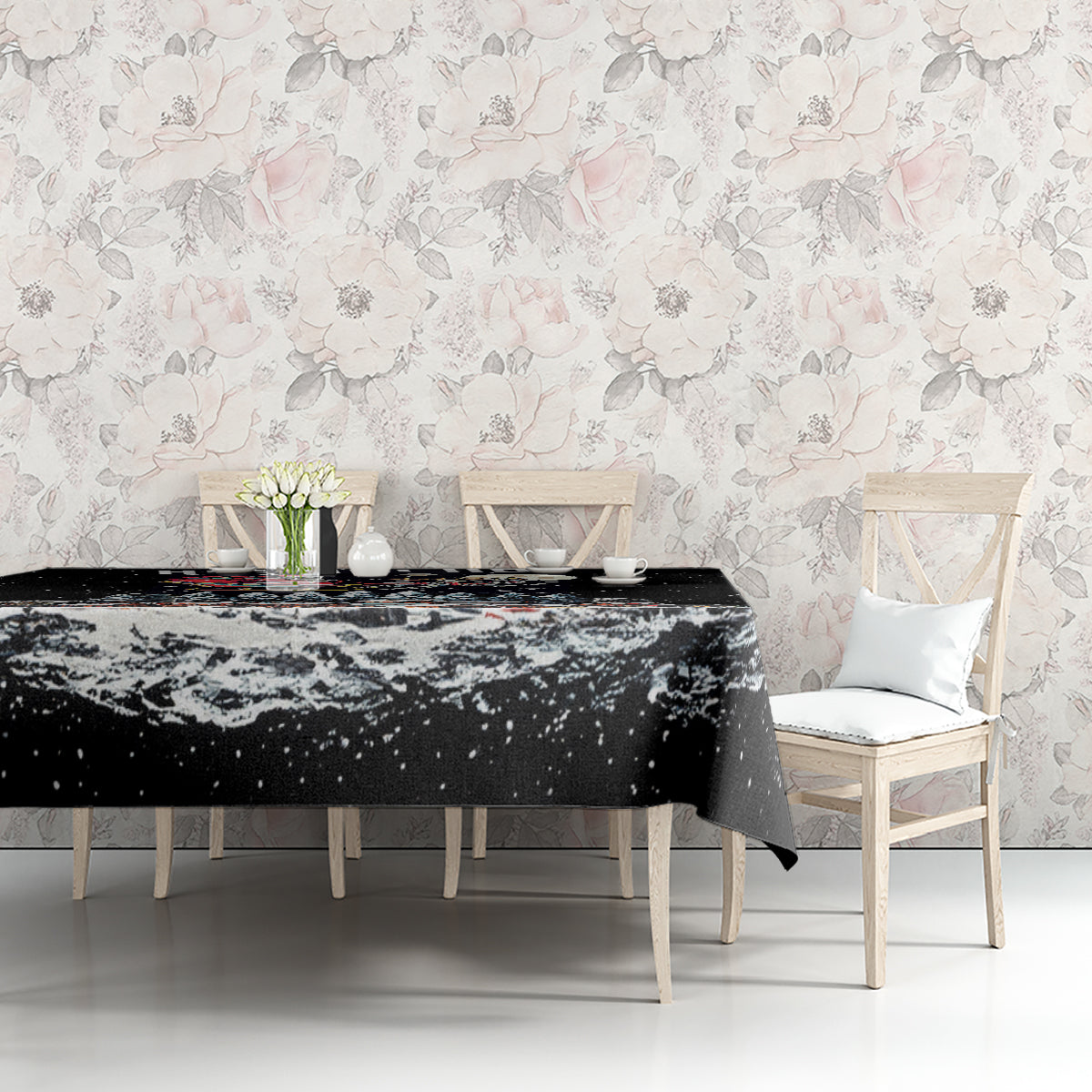 Black holiday tablecloth with winter Santa skeleton scene and scattered snow speckles