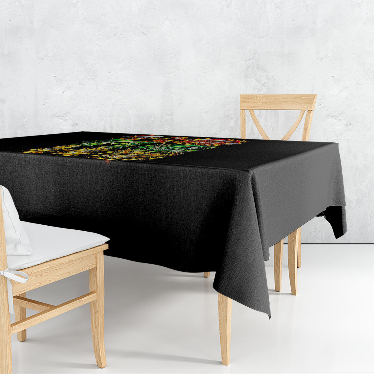 Black tablecloth with colorful sugar skull Santa design, draped over dining table corner
