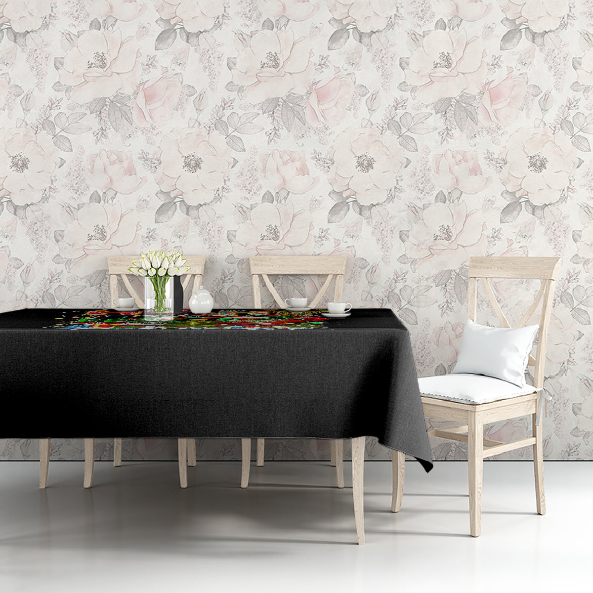 Black tablecloth with colorful skeleton Santa and candy-themed holiday print.