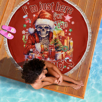 Red round beach blanket with skeleton Santa illustration, tassel fringe, and "Ho Ho Ho"