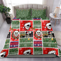 Skeleton Santa Christmas bedding set on bed: green-and-red duvet with 2 pillowcases