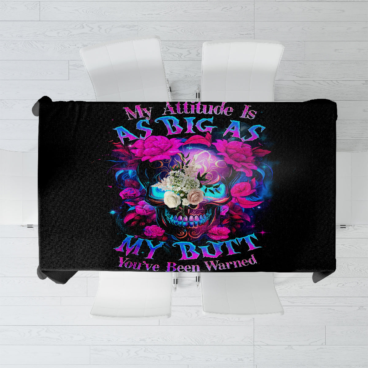 Black tablecloth with colorful sugar skull graphic centered on the fabric